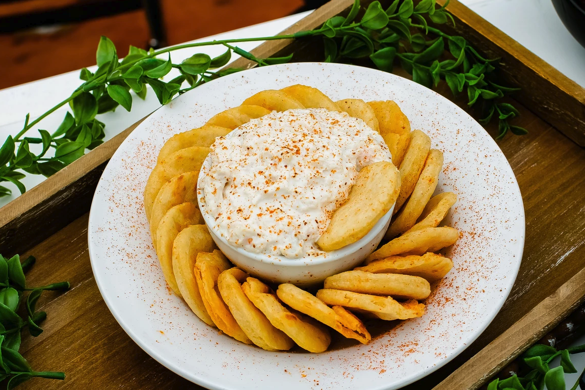 Hot crab dip with pita chips served at Surf Rider Restaurant - a seafood restaurant in Poquoson, VA offering fresh seafood and refreshing drinks
